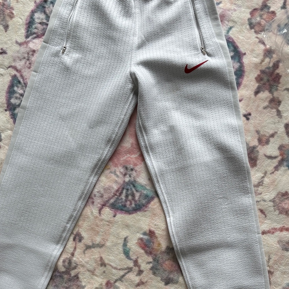 Nike White Jogger Pants with Red Swoosh. Size small. Never worn